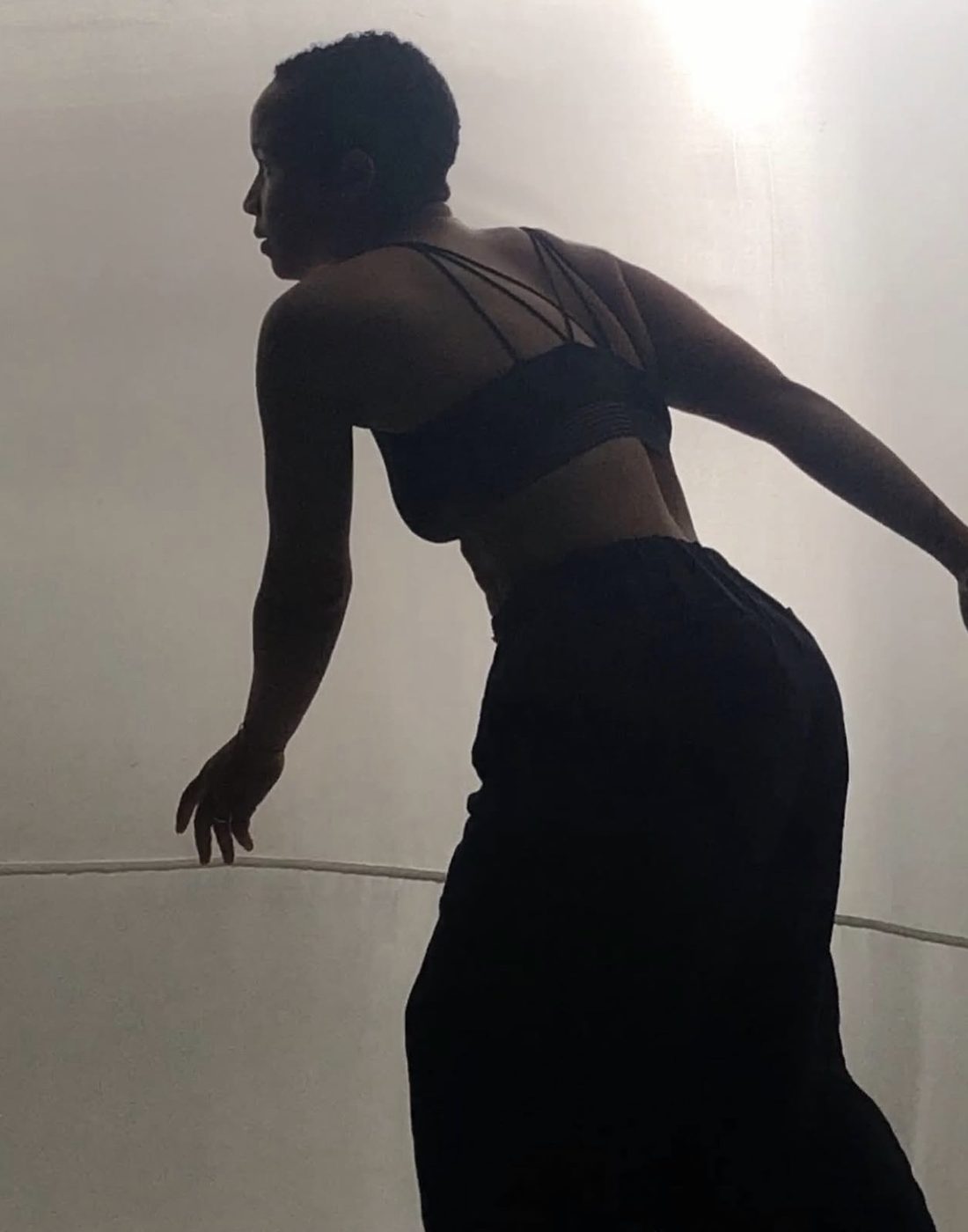 Cynthia Navarro silhouette dance in studio light